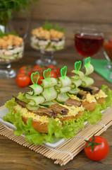Sandwiches with sprat, egg and cucumber