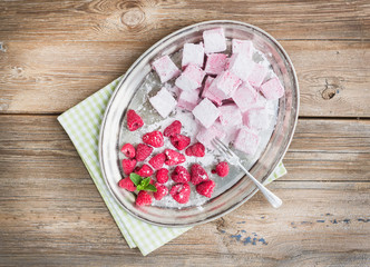 Homemade raspberry marshmallow with fresh raspberries and sugar