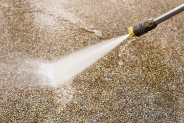 Outdoor floor cleaning with high pressure water jet