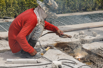 Fototapeta na wymiar A man doing welding in construction