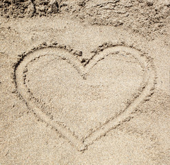 Heart drawn in the sand.
