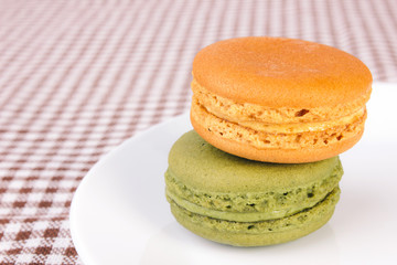 Tasty colorful macaroon on a plate
