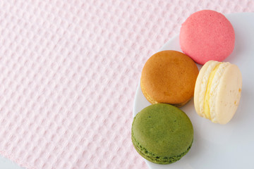 Tasty colorful macaroon on a plate