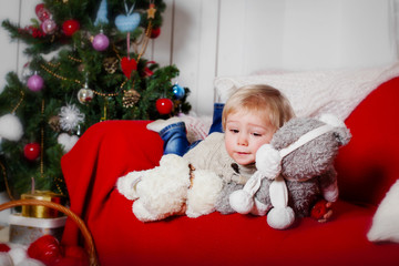 Child and Christmas tree