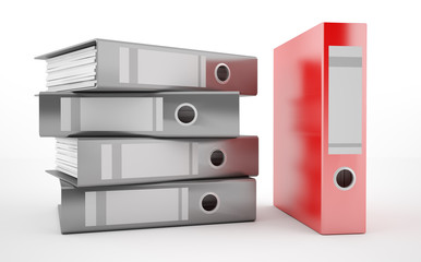 A pile of office ring binders with red binder