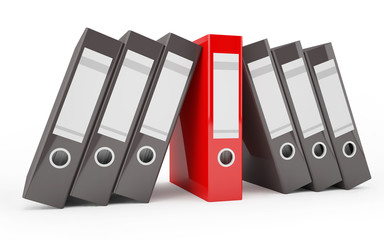 A pile of office ring binders (with a red binder in the middle)