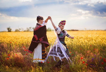 Love couple is dancing in the field