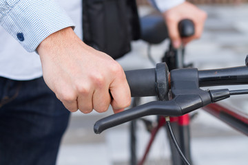 Closeup of hand on the handlebar