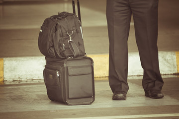 old photo of pilot carries his luggage at the airport © petunyia