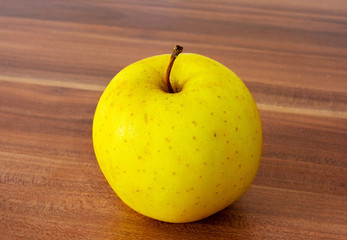 yellow apple on the table