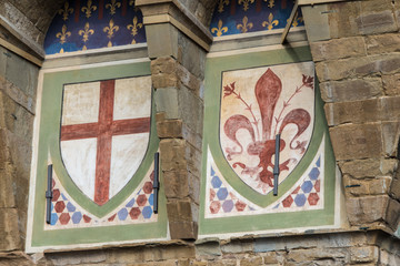 Emblems on the facade of the Palazzo Vecchio in Florence