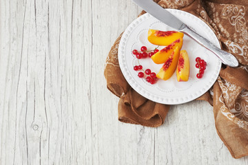 peach slices and red currants