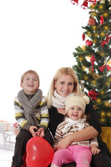 Mother and two children having fun at Christmas