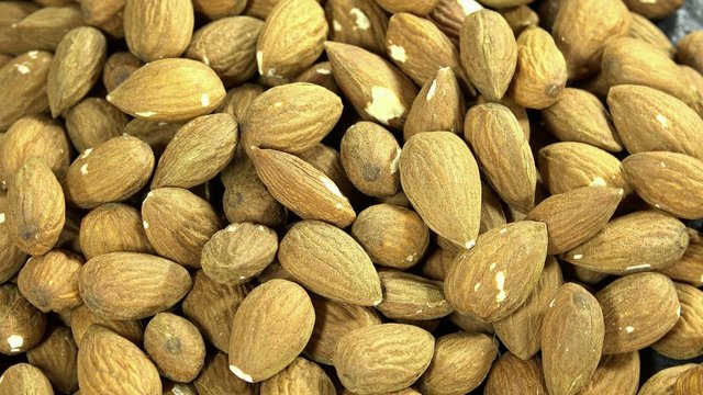 Rotating Almonds as seamless loopable 4K background footage