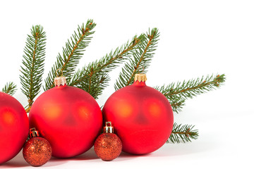 Fototapeta na wymiar red Christmas balls and fir branch