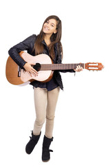 Fototapeta na wymiar Portrait of happy teenager playing guitar