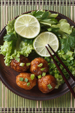 fish balls in curry sauce with lime top view vertical