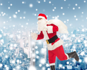 man in costume of santa claus with bag