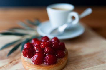 raspberry pie with coffee on a wooden table