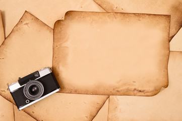 Old paper and camera for background.