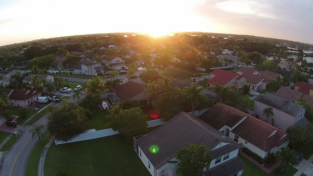 Sunset over suburna Florida homes aerial view