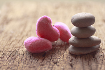 Zen stones and violet Heart on wooden - Stock Image