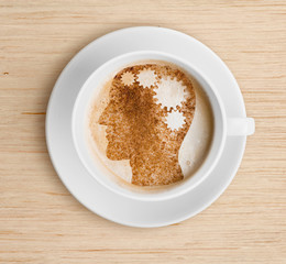 Coffee cup with brain on foam. Refreshing concept.