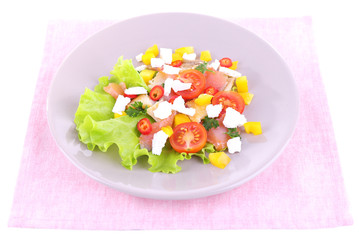 Appetizing fish salad with vegetables on plate isolated on