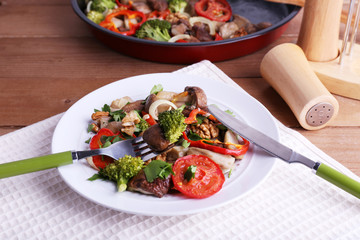 Braised wild mushrooms with vegetables and spices in pan and