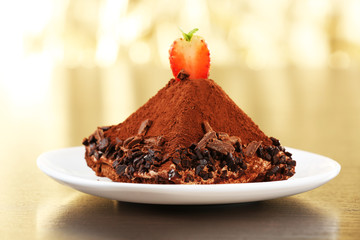 Yummy chocolate cupcake on table