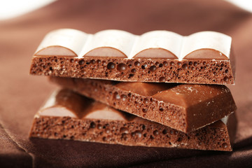 Tasty porous chocolate on table, close up