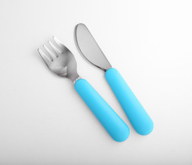 Blue baby cutlery isolated on white
