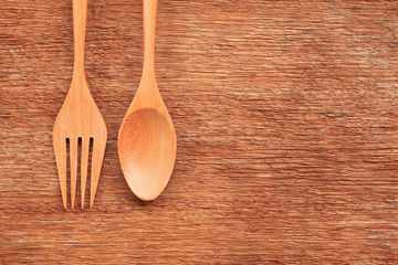 Wooden spoon and fork on table