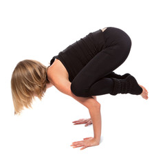 Young woman doing yoga on a white background