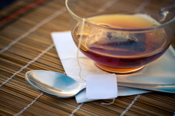 Cup of tea on table in tea house, in sunlight