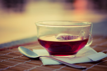 Cup of tea on table in tea house, in sunlight