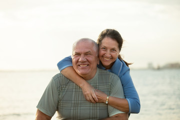 Fototapeta premium couple on beach during sunset