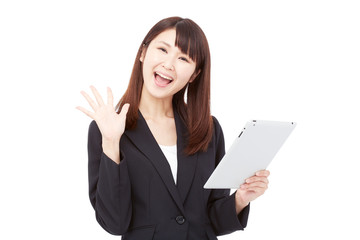 Naklejka premium タブレットを持って驚くビジネスウーマン