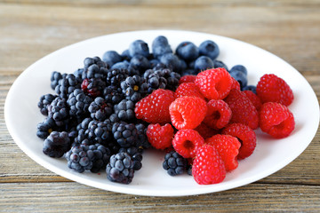 Wild berries on a white plate
