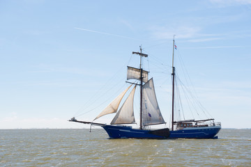 Fototapeta na wymiar Clipper on Dutch wadden sea