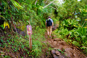 One mile sign on Kalalau trail in Kauai
