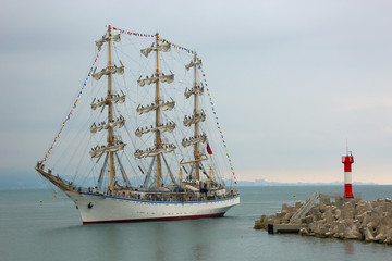 old sailing ship in front of the lighthouse © komi$ar