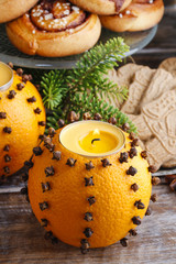 Orange pomander ball with candle,