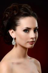 The beautiful woman in jewelry earrings