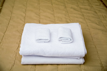 Fototapeta na wymiar Towels on hotel bed