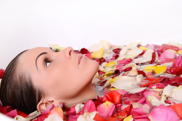 Obraz na płótnie Canvas Beautiful female in bath with rose petal. Body care.