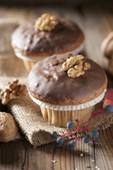 Walnuts muffins on a wooden table