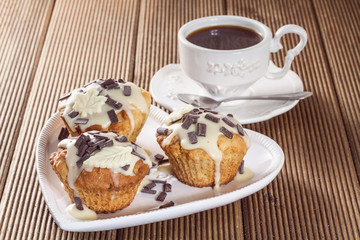 Delicious muffins with chocolate decoration