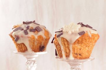Delicious muffins with chocolate decoration. Toned image.