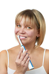 Happy woman brushing teeth and smiling isolated